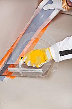 Worker apply hydro insulation tape