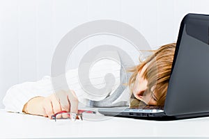 Worker, asleep on a laptop