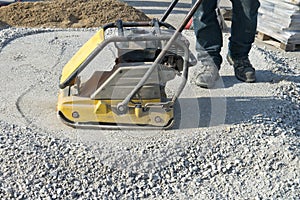 Worker With Asphalt Plate Tamper, Patio Home Improvement