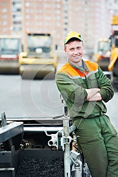 Worker at asphalting works