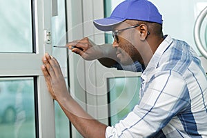 Worker during assemblage plastic door