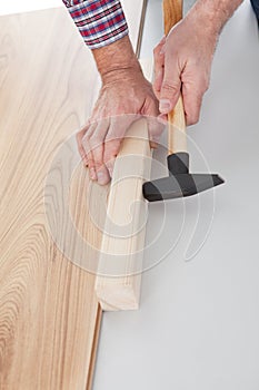 Worker assembling laminate floor