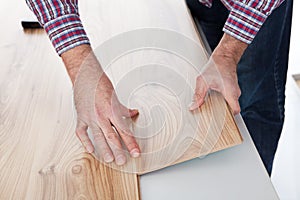 Worker assembling laminate floor