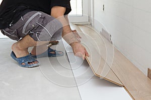 Worker assembling laminate floor