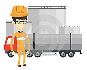 Worker on background of fuel truck and oil plant.