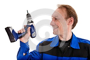 Worker with battery screwdriver in his hand