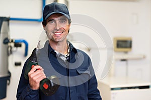 Worker blowing on a screwer