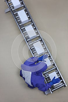 Worker in blue uniform working with boxes on packing line