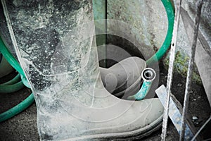 Worker boots in the construction site