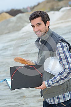 Worker bringing a bread