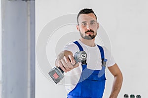 Worker builder shows a drill to the camera
