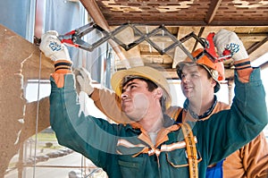 Worker builders at facade tile