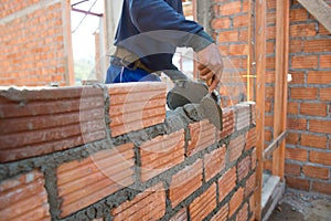 Worker building masonry house wal