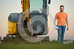 Worker at building site. Construction manager in helmet. Male construction engineer. Architect at a construction site