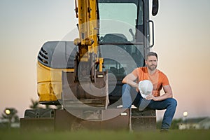 Worker at building site. Construction manager in helmet. Male construction engineer. Architect at a construction site