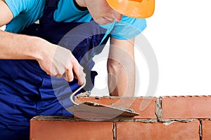 Worker building a wall