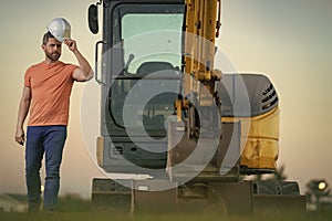 Worker with bulldozer on site construction. Man excavator worker. Construction driver worker with excavator on the