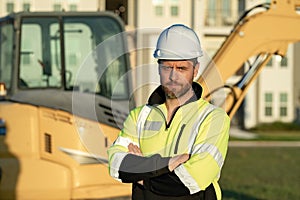 Worker with bulldozer on site construction. Man excavator worker. Construction driver worker with excavator on the