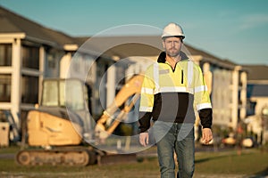 Worker with bulldozer on site construction. Man excavator worker. Construction driver worker with excavator on the