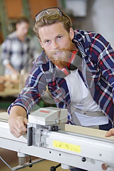 Worker in carpenters workshop