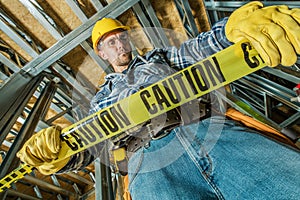 Worker with Caution Tape