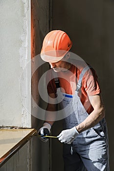 Worker is checking the correctness of the installation of a wind photo