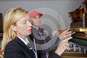 Worker checking piece art in workshop