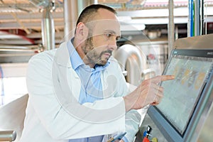 worker checking results in screen