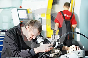 Worker checking tool with optical device