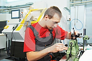 Worker checking tool with optical device