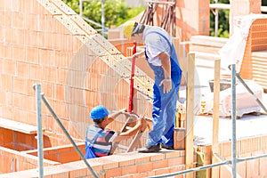 Worker checking walls on construction site