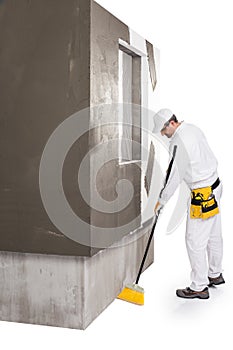 Worker cleaning with a broomstick
