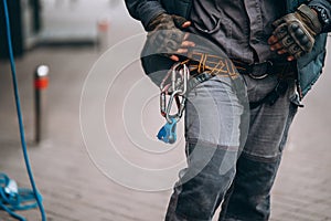 Worker climber preparing for work at height.