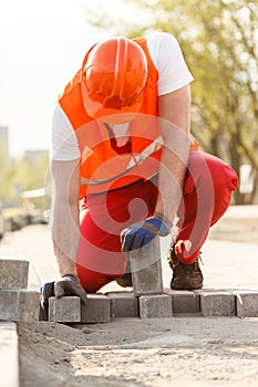 Worker with cobbles photo