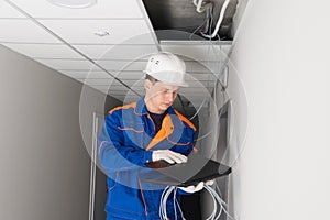 A worker configures a secure Internet in the building photo