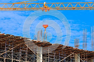 Worker construction building workplace in develop city and crane on sky background with copy space add text