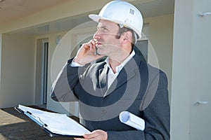 worker construction engineer on phone