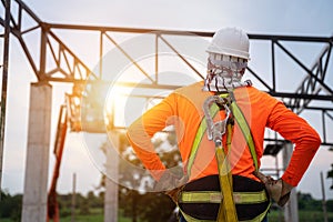 A Worker in construction site Working at height equipment. Fall arrestor device for worker with hooks for safety body harness