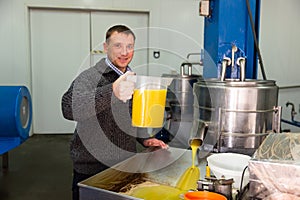 Worker controlling quality of olive oil