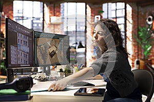 Worker in a creative office uses CAD software to design a house interior