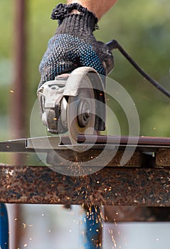 A worker cuts a metal roof for the roof