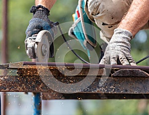 A worker cuts a metal roof for the roof