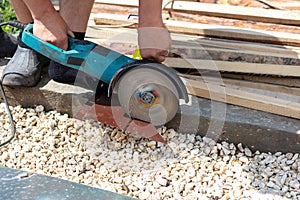 A worker cuts a metal roof for the roof