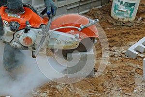 grinder worker cuts a stone the electric tool