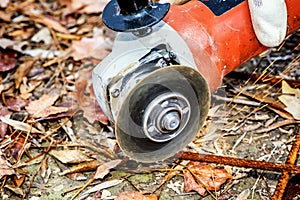 Worker cutting construction stee netl with Angle Grinder Mashin