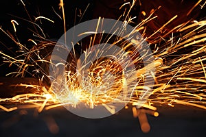 Worker cutting metal with grinder