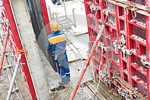 Worker disassemble falsework construction