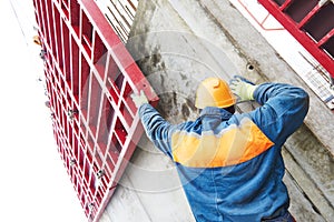 Worker disassemble falsework construction