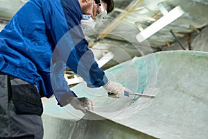 Worker Doing Boat Repairs