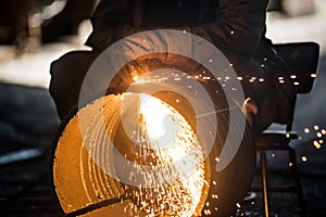 Worker doing a industrial welding in a workshop